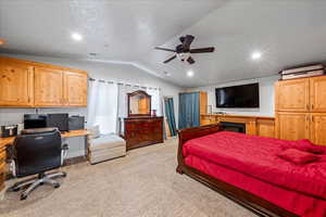 Bedroom with lofted ceiling, light carpet, recessed lighting, and ceiling fan