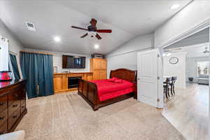 Bedroom with lofted ceiling, light carpet, recessed lighting, and a ceiling fan