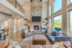 Floor to ceiling brick fireplace feature, floating shelves and bottom cabinets are included