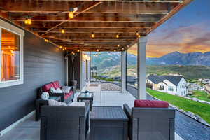 View of patio / terrace with a mountain view and an outdoor hangout area