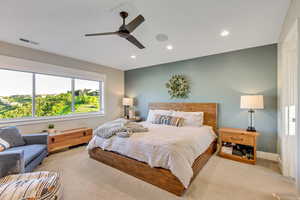 Primary bedroom with oversized windows for the view.