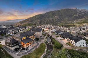 Aerial view at dusk of a residential view and a mountain view