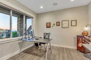 Home office featuring, wood finished floors, and recessed lighting