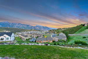 View of mountain backdrop featuring nearby suburban area