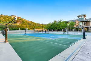 View of sport court featuring community basketball court and a tennis court