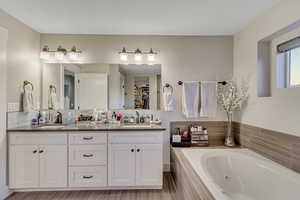 Primary bathroom, double vanity and jetted tub
