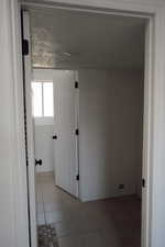 Tiled spare room with baseboards