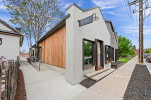 View of side of home with stucco siding