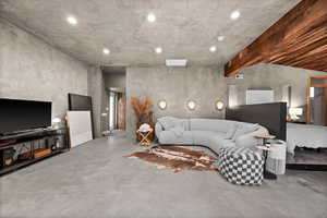 Living room featuring finished concrete floors