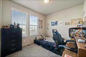 Bedroom with carpet and baseboards