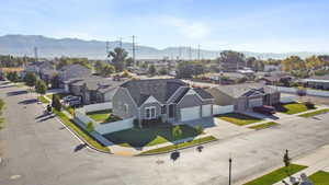 Aerial view of residential area featuring a mountainous background