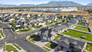 Aerial perspective of suburban area with a mountainous background