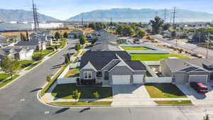 Aerial view of residential area featuring a mountainous background