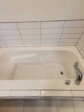 Full bathroom featuring tile patterned floors and a bath