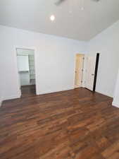 Unfurnished room with baseboards, a ceiling fan, dark wood-type flooring, and recessed lighting