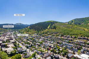 View of mountain background featuring nearby suburban area