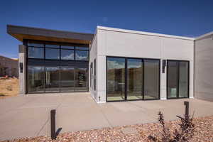 Rear view of house featuring a patio
