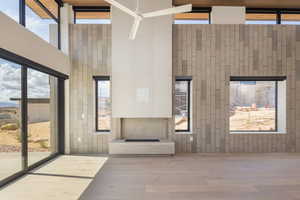 Common area with a towering ceiling and wooden walls