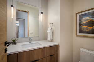 Bathroom featuring vanity and toilet