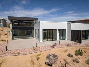 Rear view of house featuring a patio