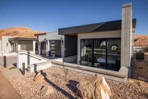 View of side of home with a mountain view