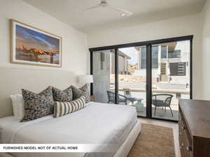 Bedroom featuring access to outside, wood finished floors, recessed lighting, and ceiling fan