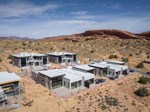 View of subject property featuring a desert landscape and a mountainous background