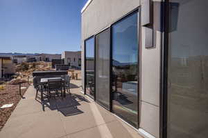 Balcony featuring outdoor dining area and a mountain view