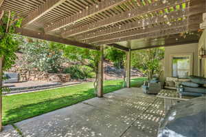 View of patio with a pergola and outdoor lounge area