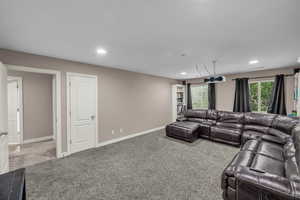 Living room featuring carpet and recessed lighting