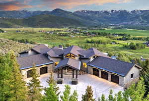 View of subject property with mountains