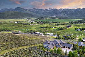 View of mountain backdrop featuring rural landscape