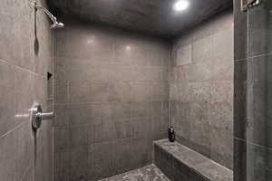 Full bath with a tile shower