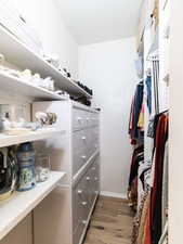Walk in closet featuring light wood-type flooring