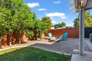 Fenced backyard with a patio