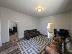 Living area featuring LVP flooring & high ceilings