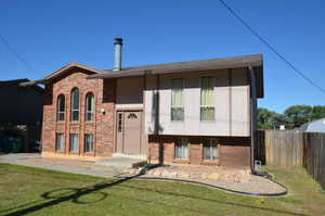 Bi-level home with brick siding
