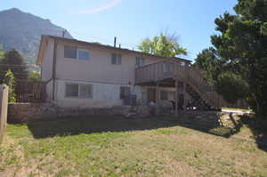 Rear view of property with stairs, a deck, and cooling unit
