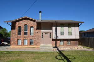View of front of house featuring brick siding