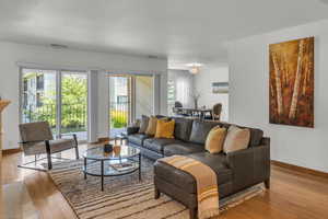 Living area with hardwood / wood-style floors and baseboards