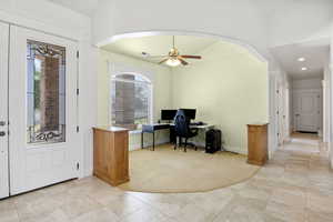 Entryway featuring light tile patterned floors, with formal living room.