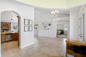 Entrance foyer featuring arched walkways.