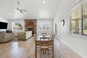 Dining area with plenty of natural light and lofted ceilings