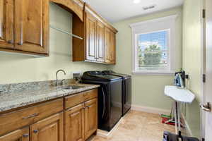 Laundry area with cabinet space.
