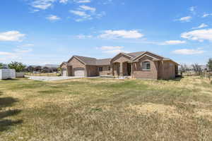 Ranch-style home with brick siding, a garage, and concrete driveway