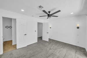 Unfurnished bedroom featuring carpet, recessed lighting, baseboards, and a ceiling fan
