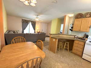 Dining space with a ceiling fan