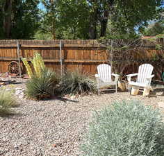 View of backyard with sitting areas