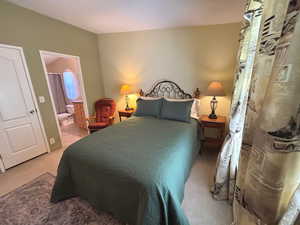Master bedroom featuring ensuite bath