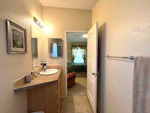 Master bathroom with vanity and ensuite bathroom